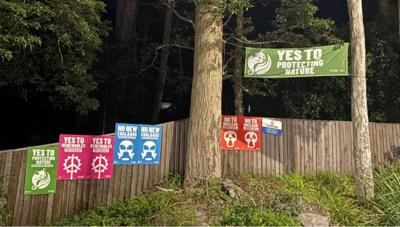 Sticker sheet with various colorful designs, including text and illustrations.