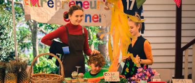 The Gole family and friends fundraise at their local market every month to help ACF stop the Carmichael coal mine.