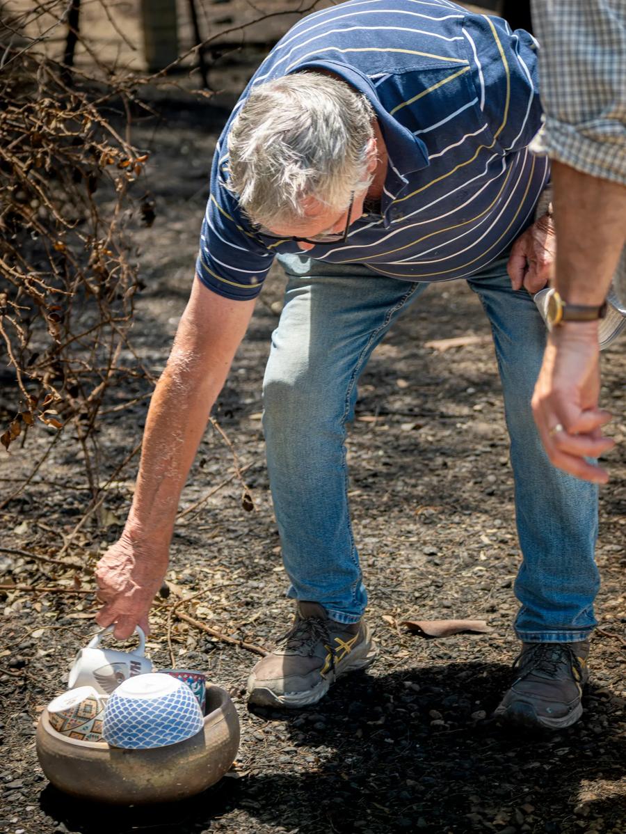 Jim Billings at the ruins of his home