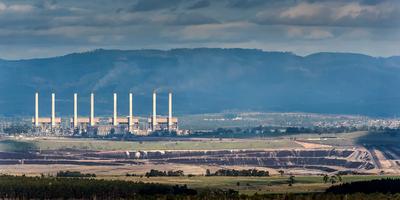 Header image: Hazelwood power station, smokestacks, blue sky.