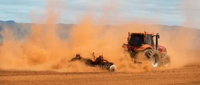 Depleted soil, cracked earth, barren landscape, environmental damage, nature risk.