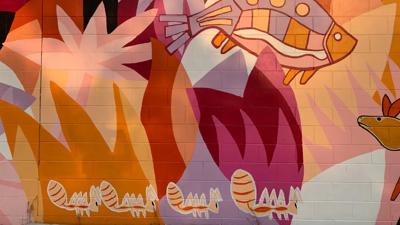 Mural with colorful abstract shapes and patterns.