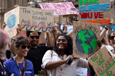 Header image: School strike protest banner, crowd of people, text.