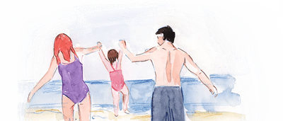 Seaside scene, blue ocean, sandy beach, white building, clear sky.