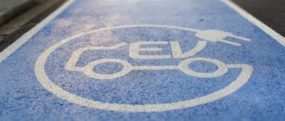 EV charging station sign, ACF, net zero emissions.