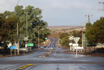 Kimba Crossing landscape, road, trees, blue sky.