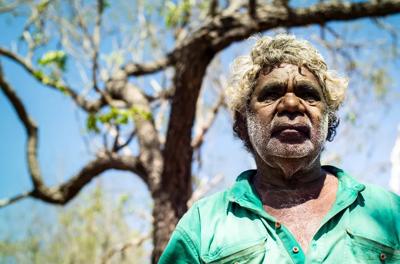 Man in hat, smiling, outdoor portrait, trees in background, Jack.