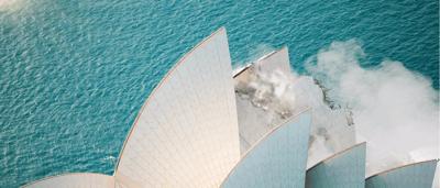 Sailing boats on water, blue sky, white sails, compressed image.