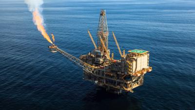 Offshore gas platform, ocean, sky, photo.