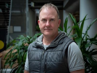 Man, Gavan McFadzean, ACF Program Manager, smiling, headshot.