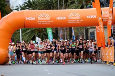 HOKA Sydney Half Marathon runners, cityscape background.