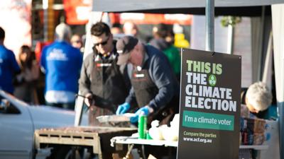 People voting at a polling station on election day 2019.