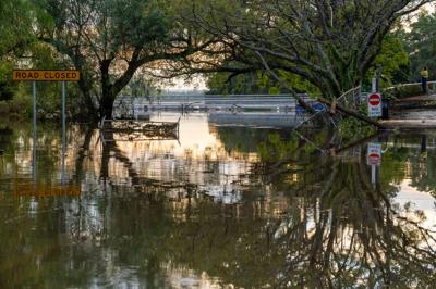 Header image: Flooded landscape, water covering fields, dark sky.