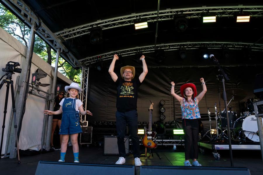 Adam and his daughters performing the choreographed family dance