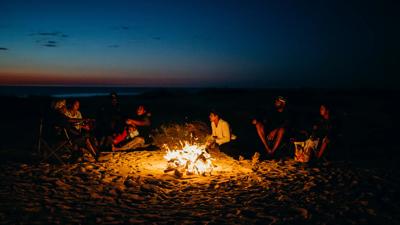 Campfire scene, Kimberley Rangers, ACF supporters, Karajarri Rangers, night.