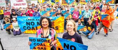 Brisbane skyline at dusk, with city lights reflecting on the river. "Rise Up" text overlay.