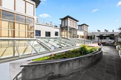Victorian building, Leicester Street, Carlton. Brick facade, ornate details, street view.