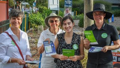 People at a polling booth, voting.