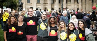 A person standing in a forest, with text overlay.