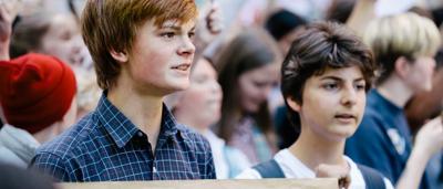 Kids striking for climate in Melbourne, holding signs.